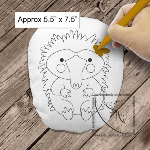 Cute echidna colouring stuffie ITH machine embroidery design with child's hand colouring it in and label saying size is approximately 5.5" x 7.5"